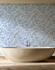 Blush Serenade Delft floral damask wallpaper creating ambiance in a serene spa bathroom
