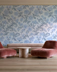 Blush Serenade Delft floral damask wallpaper in a boutique hotel sitting area