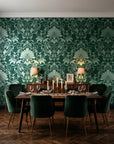 Blushed Whisper Emerald distressed damask wallpaper in a dark moody dining room with a candlelit table