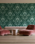 Blushed Whisper Emerald distressed damask wallpaper in a boutique hotel sitting area