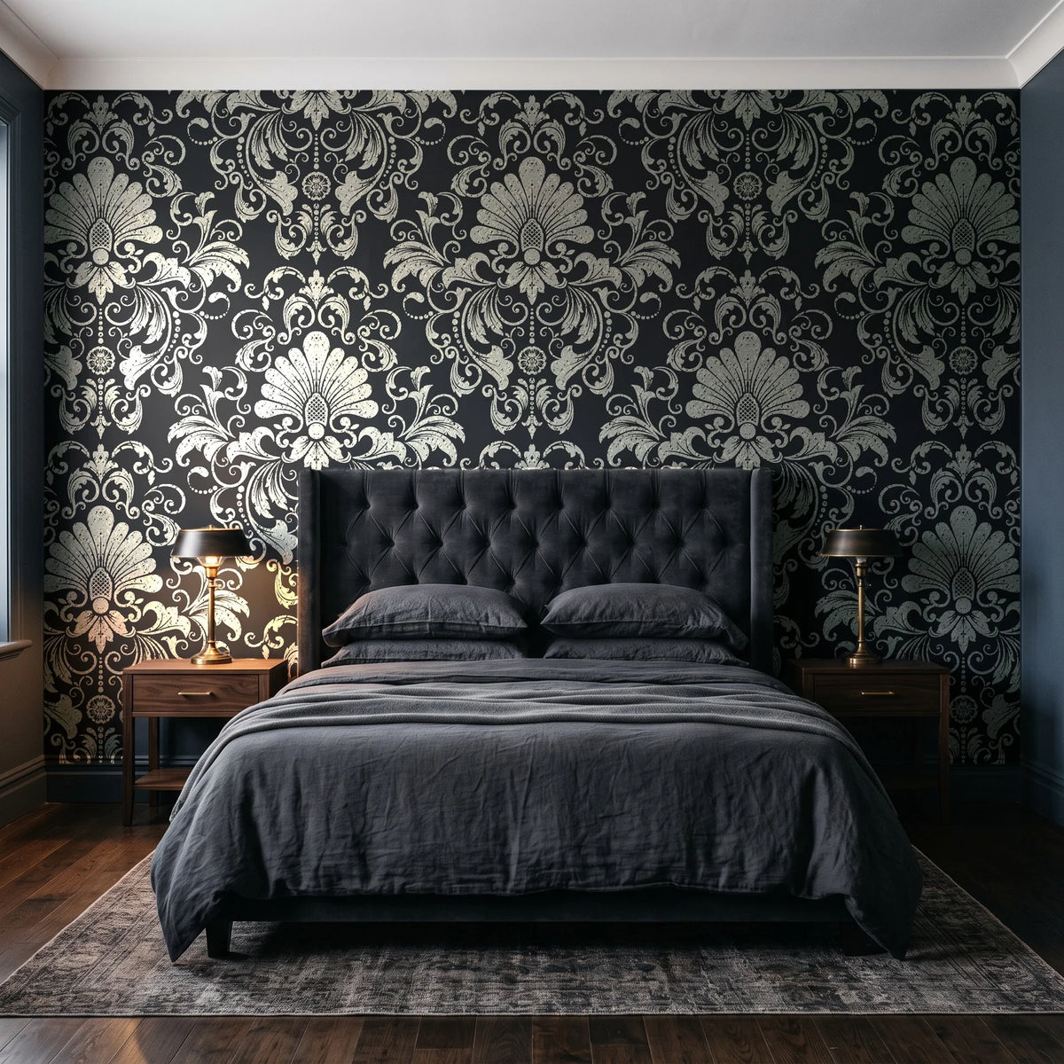 Blushed Whisper Graphite distressed damask wallpaper behind a tufted headboard in a dark, moody bedroom