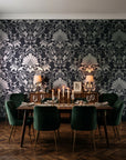 Blushed Whisper Graphite distressed damask wallpaper in a dark moody dining room with a candlelit table