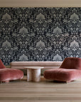 Blushed Whisper Graphite distressed damask wallpaper in a boutique hotel sitting area