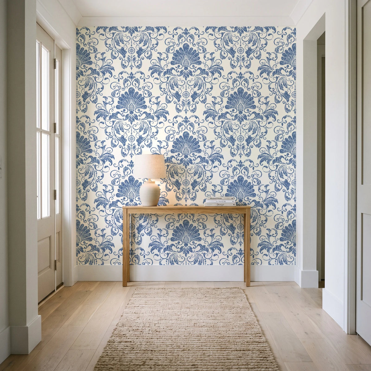 Blushed Whisper Linen distressed damask wallpaper behind a console table in a light entry hallway