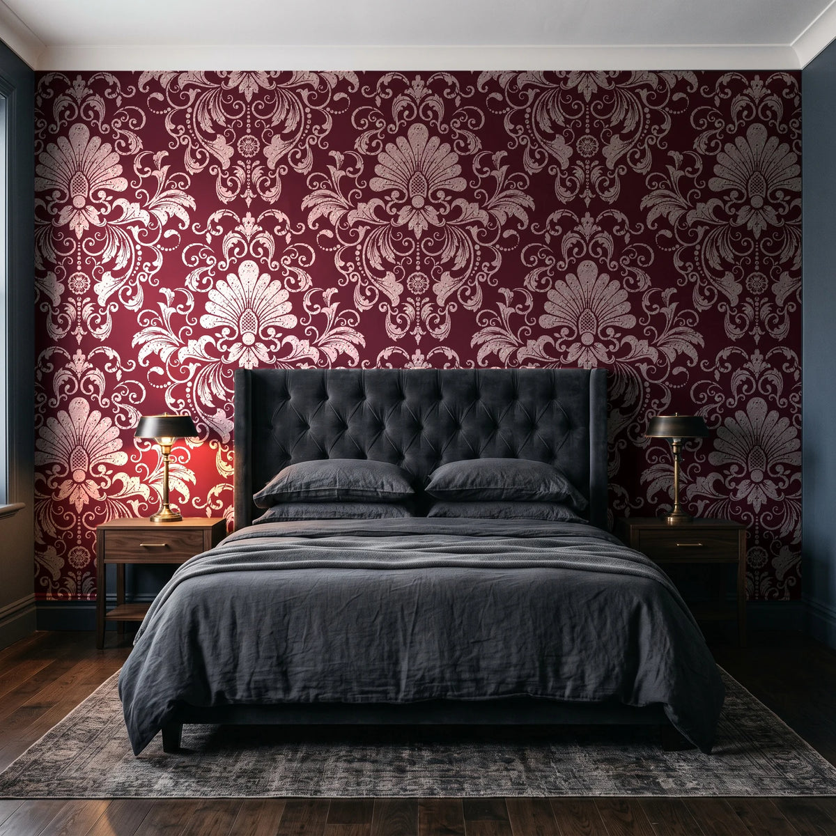 Blushed Whisper Oxblood distressed damask wallpaper behind a tufted headboard in a dark, moody bedroom