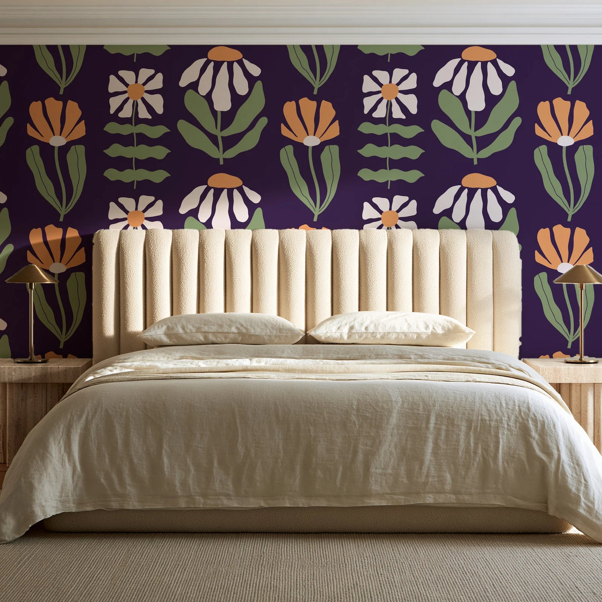 Bohemian Daisy Aubergine retro floral wallpaper behind a channel-tufted bed in a calm primary bedroom