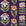 Bohemian Daisy Aubergine retro floral wallpaper in aubergine, apricot and blush
