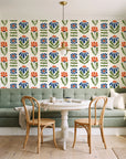 Bohemian Daisy Cream retro floral wallpaper as a feature wall in a sunlit breakfast nook