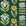 Bohemian Daisy Forest retro floral wallpaper in forest green, marigold and ivory