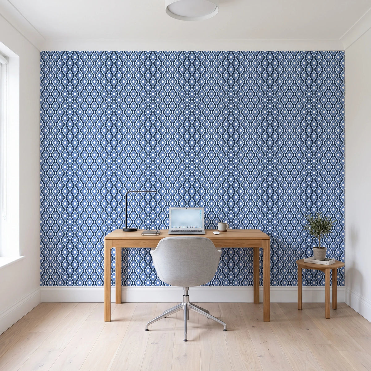 Butter Ogee Midnight ogee trellis wallpaper behind a modern oak desk in a bright home office