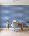 Butter Ogee Midnight ogee trellis wallpaper behind a modern oak desk in a bright home office