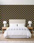 Butter Ogee Noir ogee trellis wallpaper behind a queen bed in a bright coastal bedroom