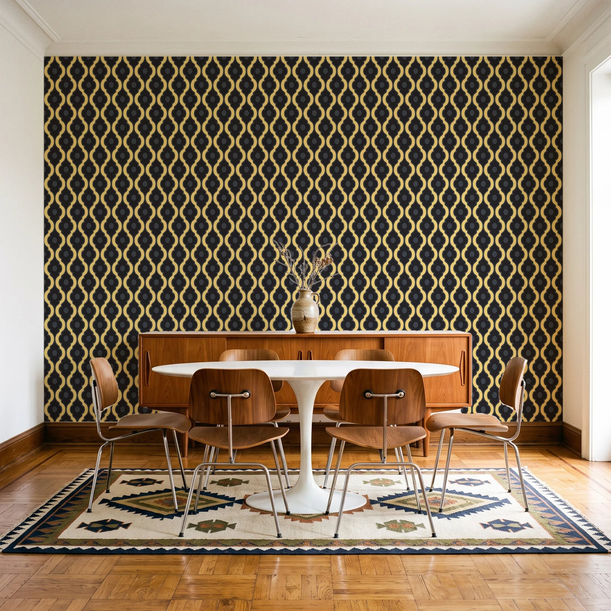 Butter Ogee Noir ogee trellis wallpaper in a mid-century dining room with a teak sideboard and tulip table