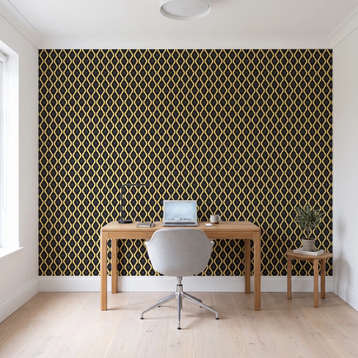 Butter Ogee Noir ogee trellis wallpaper behind a modern oak desk in a bright home office