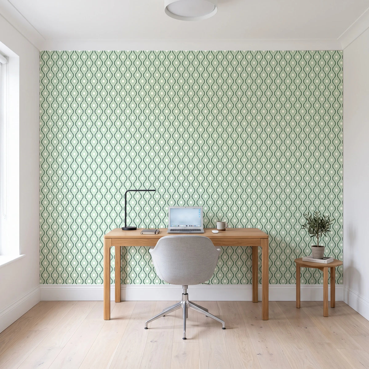 Butter Ogee Sage ogee trellis wallpaper behind a modern oak desk in a bright home office