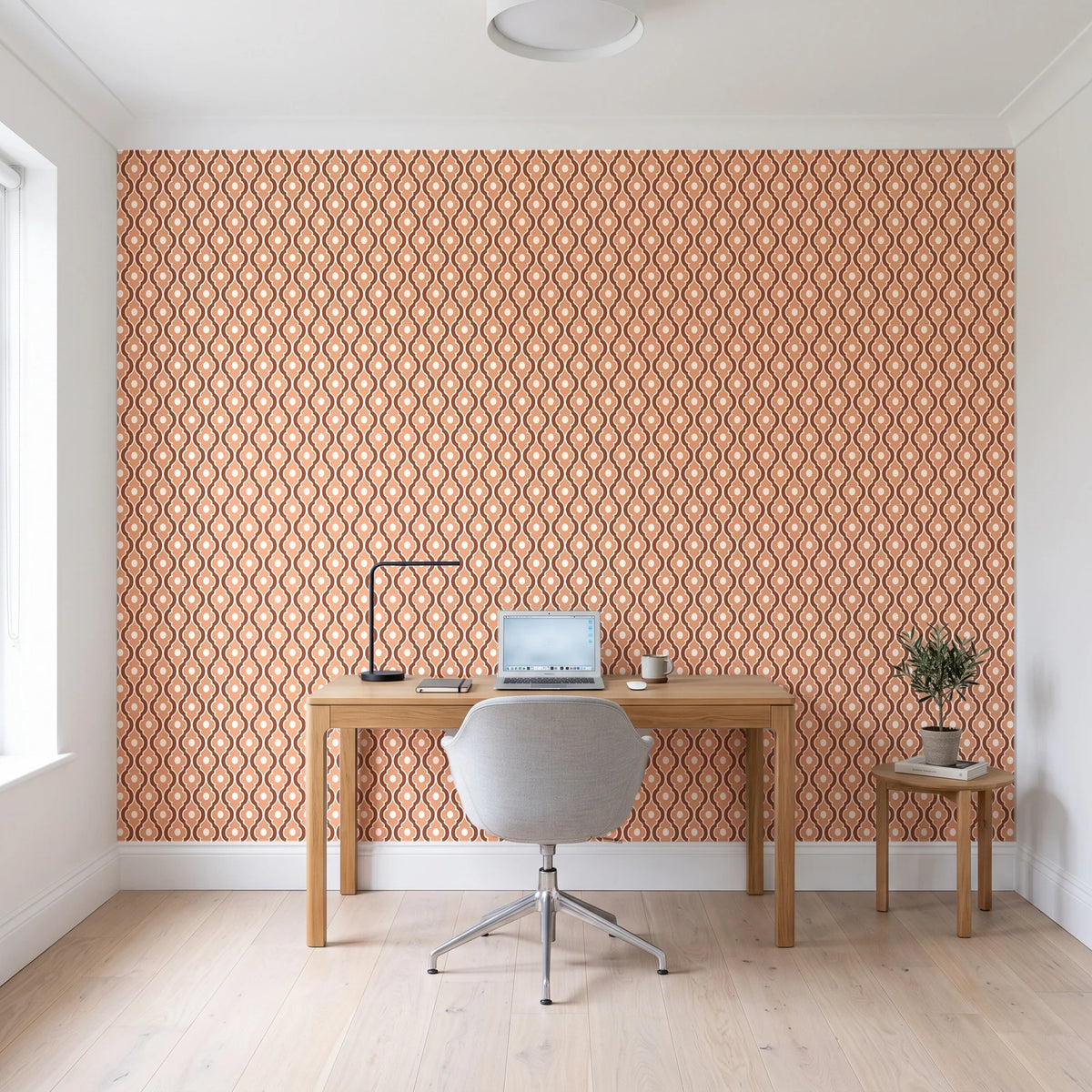 Butter Ogee Terracotta ogee trellis wallpaper behind a modern oak desk in a bright home office