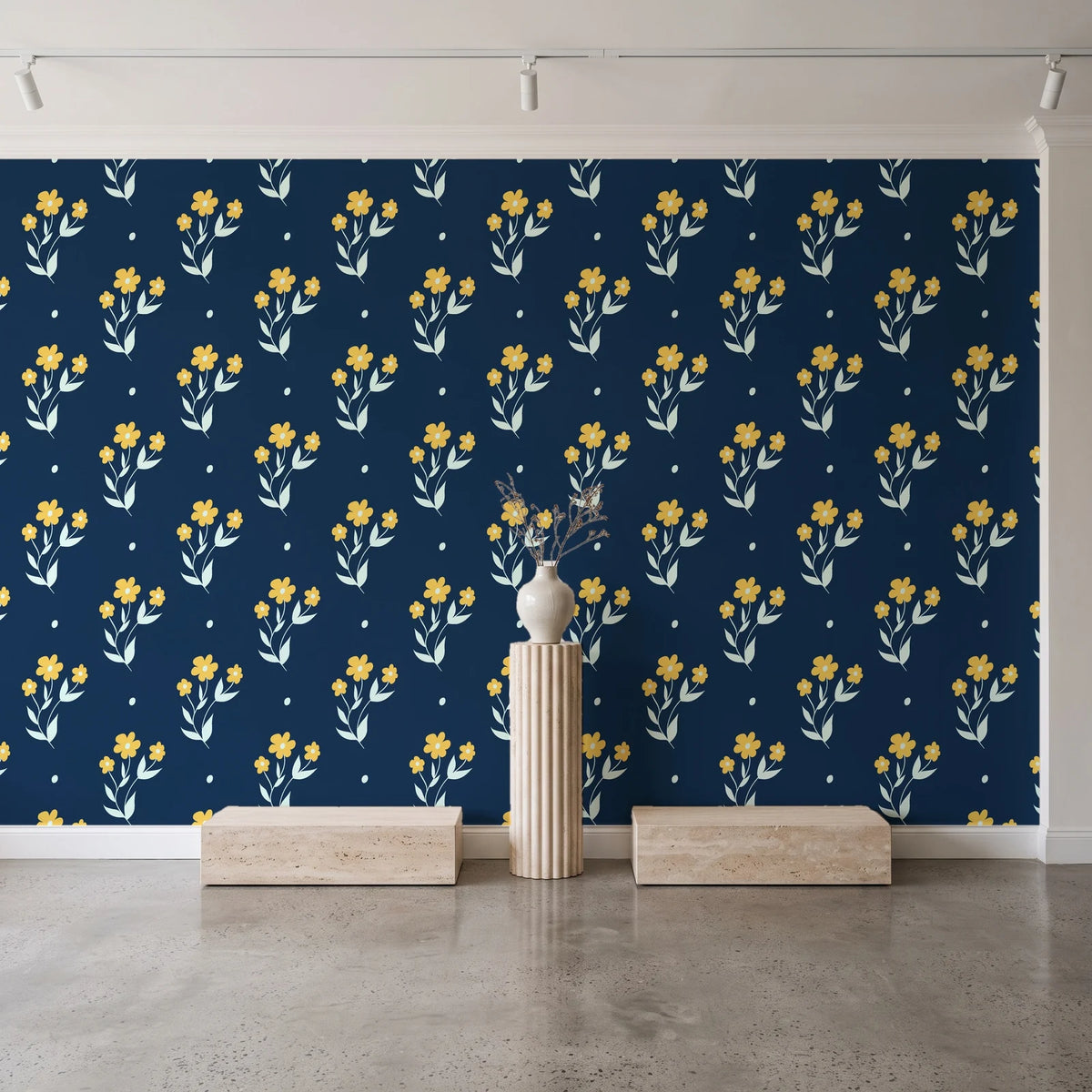 Buttercup Meadow Midnight floral sprig wallpaper behind a travertine pedestal and vase in a minimal boutique