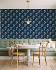 Buttercup Meadow Midnight floral sprig wallpaper as a feature wall in a sunlit breakfast nook