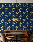 Buttercup Meadow Midnight floral sprig wallpaper behind a walnut credenza and round table in an elegant dining room