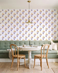 Buttercup Meadow Plum floral sprig wallpaper as a feature wall in a sunlit breakfast nook