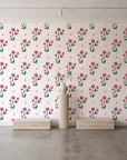 Buttercup Meadow Rose floral sprig wallpaper behind a travertine pedestal and vase in a minimal boutique
