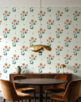 Buttercup Meadow Sage floral sprig wallpaper behind a walnut credenza and round table in an elegant dining room
