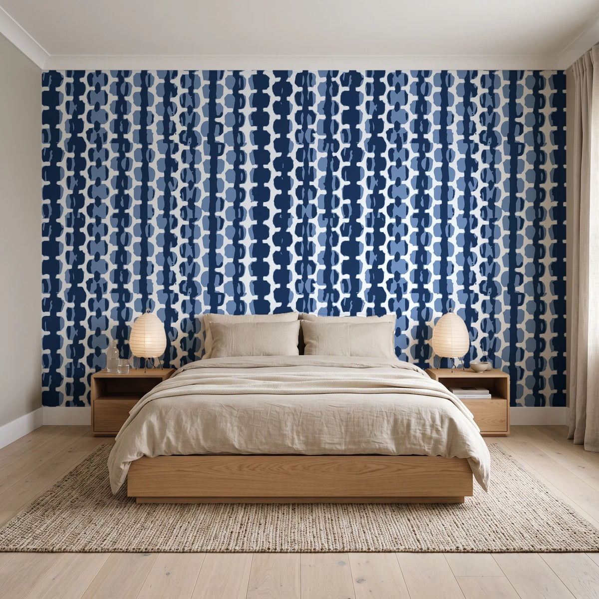 Cactus Lane Navy abstract stripe wallpaper behind a low platform bed in a serene Japandi bedroom