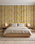 Cactus Lane Ochre abstract stripe wallpaper behind a low platform bed in a serene Japandi bedroom