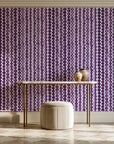 Cactus Lane Plum abstract stripe wallpaper on the wall of a grand entry foyer