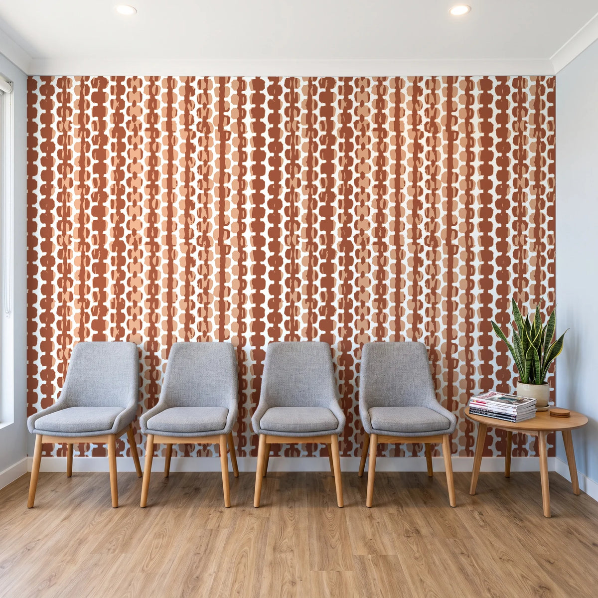 Cactus Lane Terracotta abstract stripe wallpaper behind a row of upholstered chairs in a bright clinic waiting room