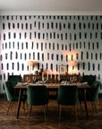 Canvas Dash Charcoal minimalist dashes wallpaper in a dark moody dining room with a candlelit table