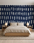 Canvas Dash Midnight minimalist dashes wallpaper behind a low platform bed in a serene Japandi bedroom