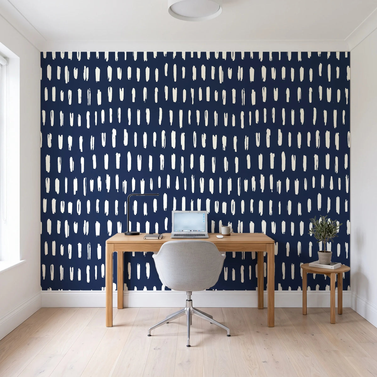 Canvas Dash Midnight minimalist dashes wallpaper behind a modern oak desk in a bright home office