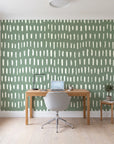Canvas Dash Sage minimalist dashes wallpaper behind a modern oak desk in a bright home office
