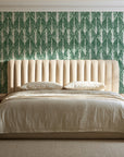 Canyon Ikat Forest geometric wallpaper behind a channel-tufted bed in a calm primary bedroom