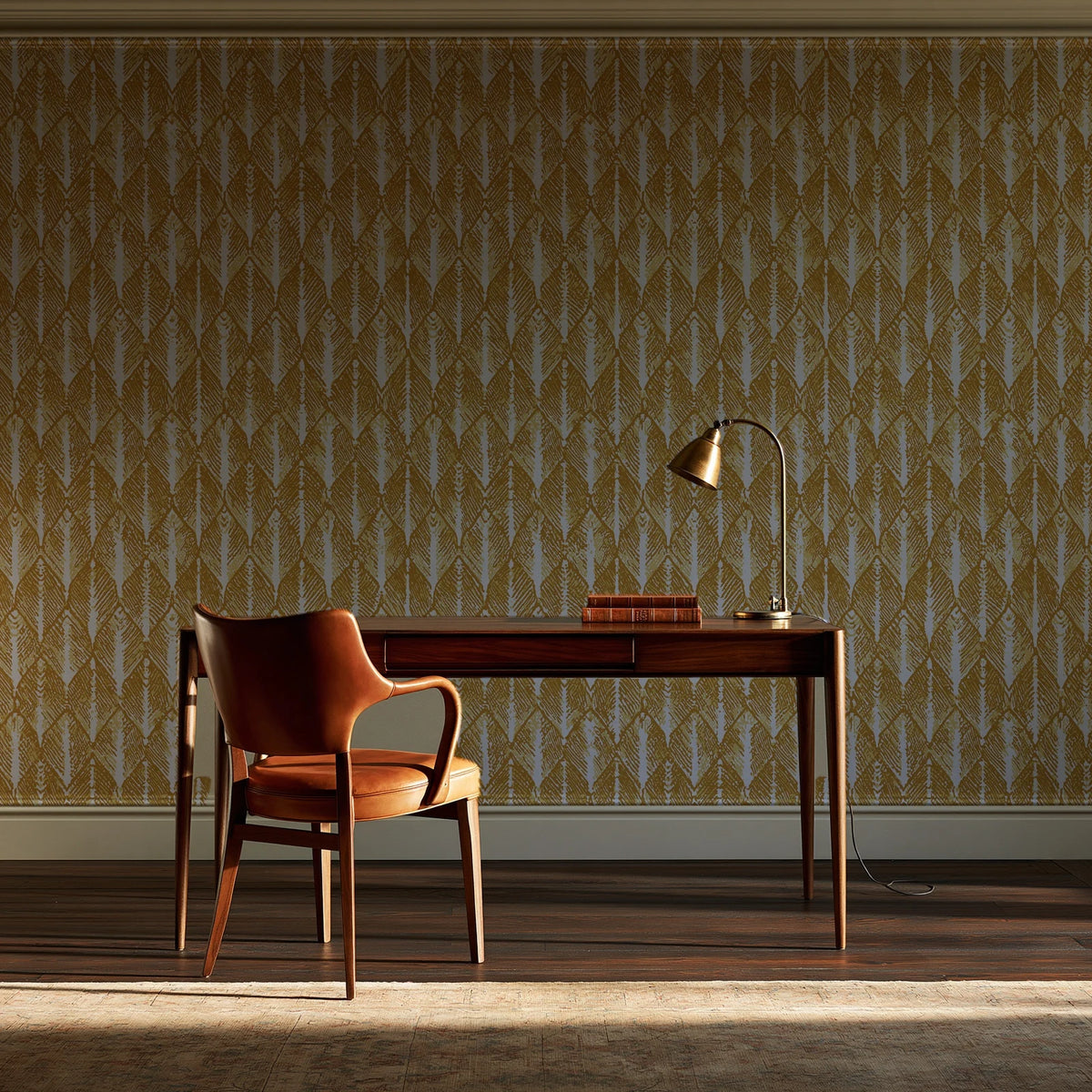Canyon Ikat Ochre geometric wallpaper as a feature wall in a home study