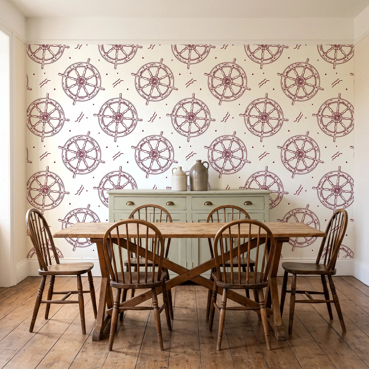 Captain's Wheel Burgundy nautical ship wheel wallpaper in a farmhouse dining room with a sage sideboard and rustic trestle table