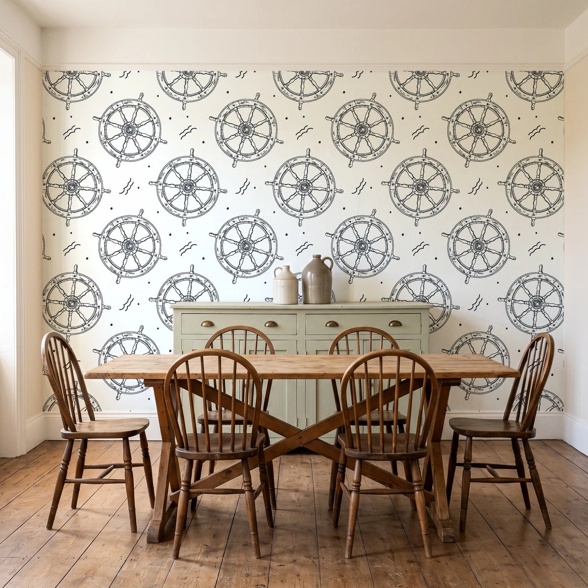 Captain's Wheel Charcoal nautical ship wheel wallpaper in a farmhouse dining room with a sage sideboard and rustic trestle table