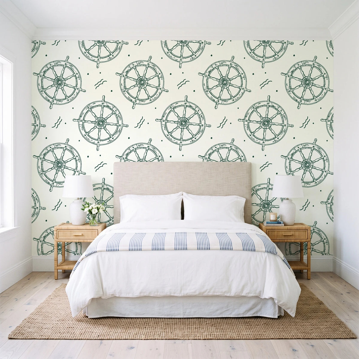 Captain's Wheel Evergreen nautical ship wheel wallpaper behind a queen bed in a bright coastal bedroom