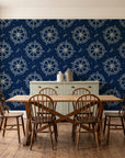 Captain's Wheel Midnight nautical ship wheel wallpaper in a farmhouse dining room with a sage sideboard and rustic trestle table
