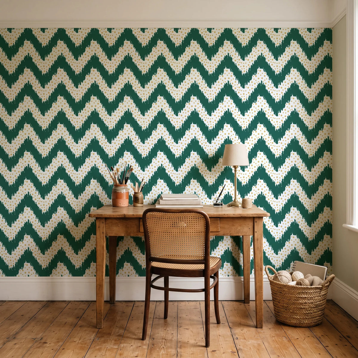 Caramel Drip Emerald chevron wallpaper behind a vintage writing desk in a cozy craft-room home office