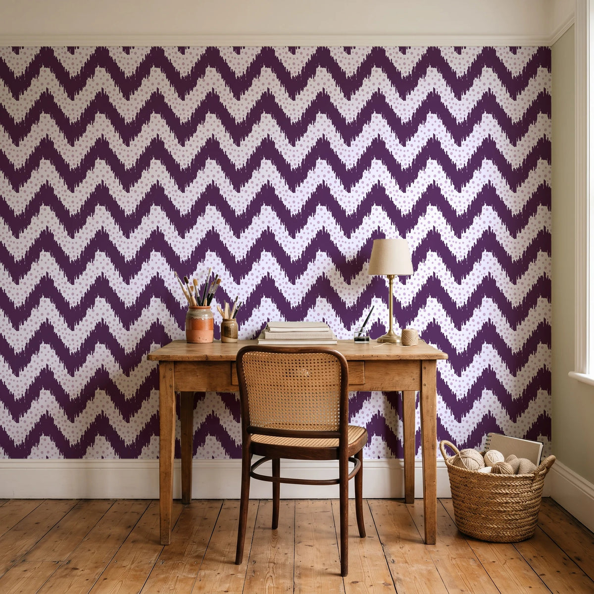 Caramel Drip Plum chevron wallpaper behind a vintage writing desk in a cozy craft-room home office