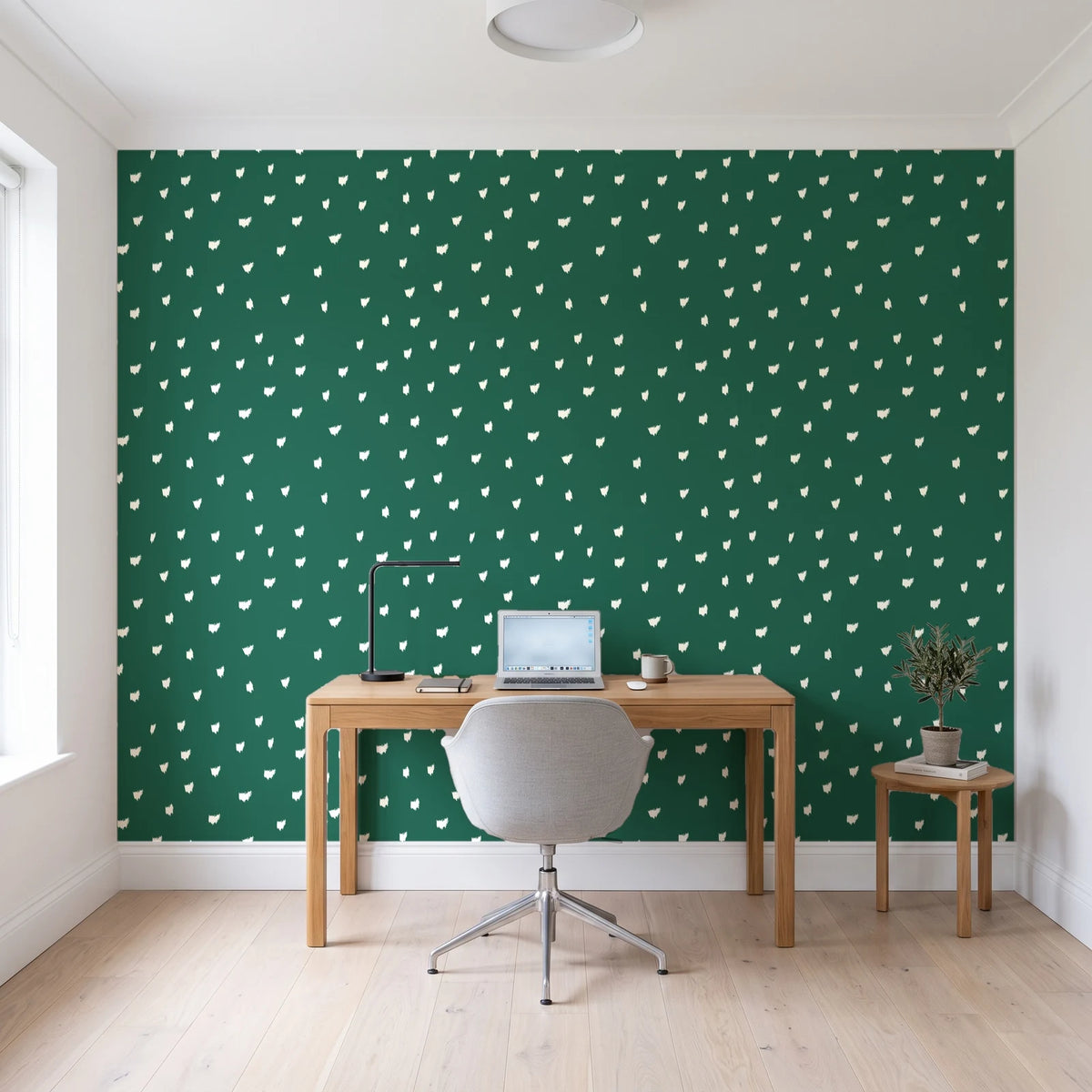 Caramel Haze Emerald brushstroke dot wallpaper behind a modern oak desk in a bright home office