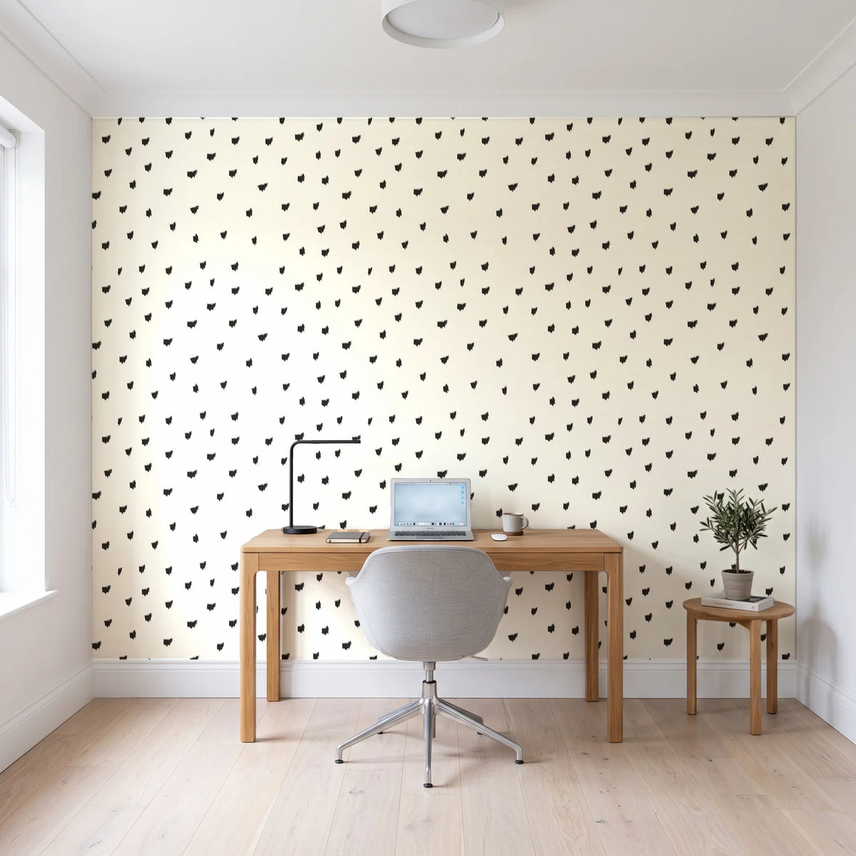 Caramel Haze Ivory brushstroke dot wallpaper behind a modern oak desk in a bright home office