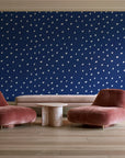 Caramel Haze Navy brushstroke dot wallpaper in a boutique hotel sitting area
