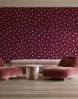 Caramel Haze Oxblood brushstroke dot wallpaper in a boutique hotel sitting area