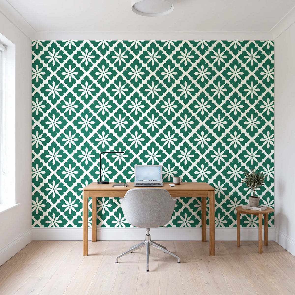 Carbon Bloom Emerald tile floral wallpaper behind a modern oak desk in a bright home office