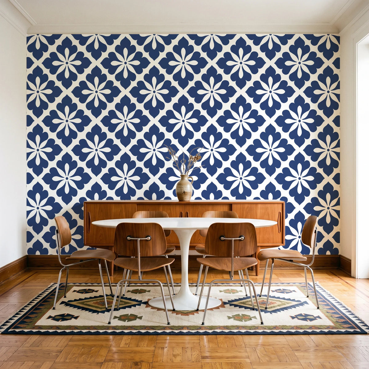 Carbon Bloom Navy tile floral wallpaper in a mid-century dining room with a teak sideboard and tulip table