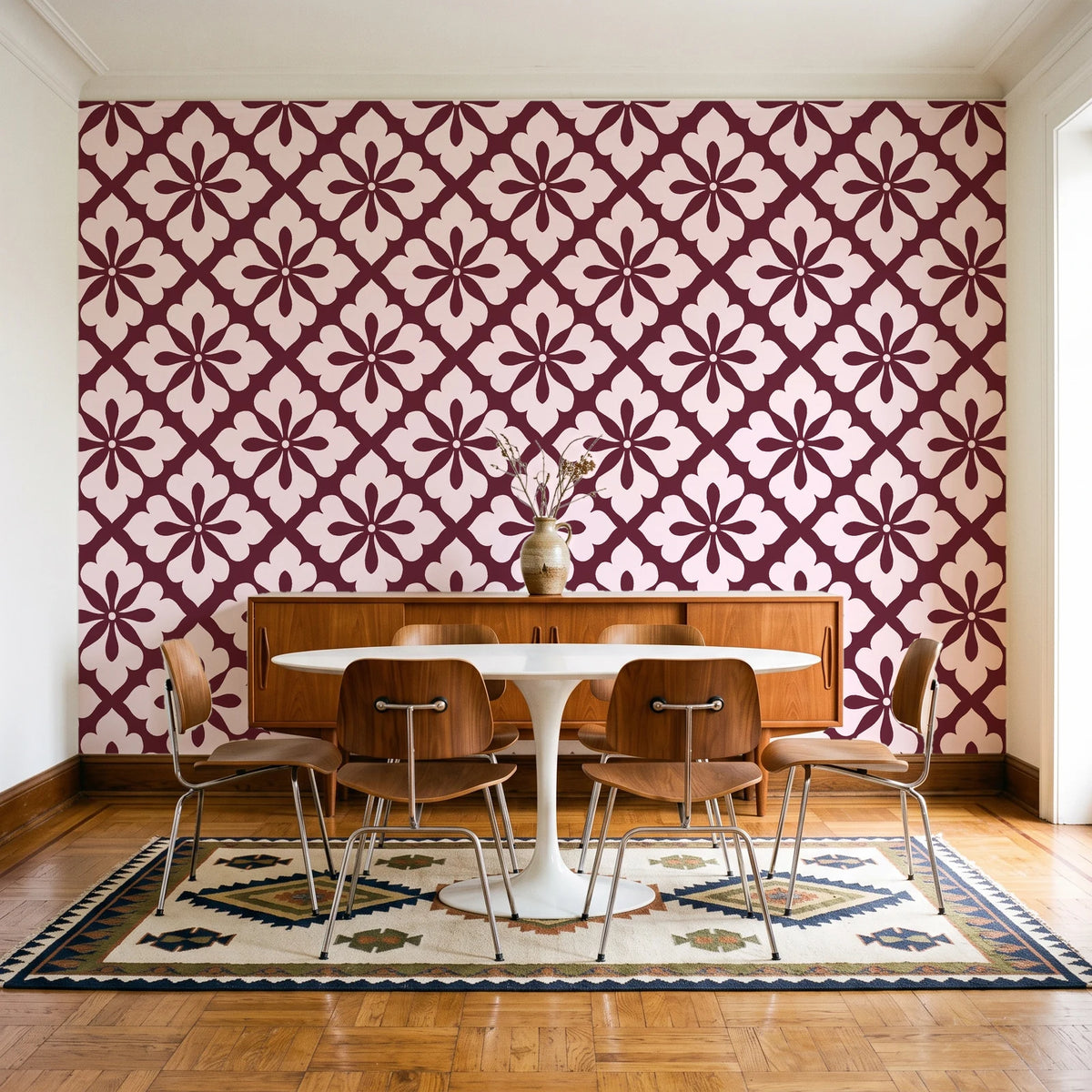Carbon Bloom Oxblood tile floral wallpaper in a mid-century dining room with a teak sideboard and tulip table