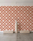 Carbon Bloom Terracotta tile floral wallpaper behind a travertine pedestal and vase in a minimal boutique